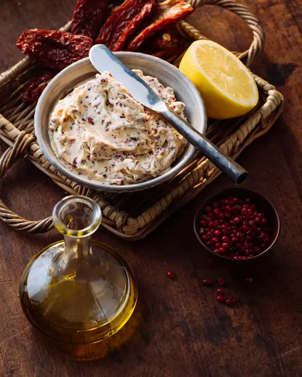 Herb butter with dried tomatoes and olives