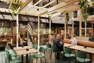 3D-illustrasjon av kantinen i Vika Atrium, med møbler i lyst treverk, grønne klatreplanter og naturlig lys som kommer inn fra taket