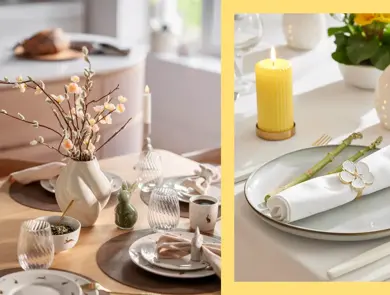 Dekket bord med servise, vase med grener og tente lys. Kuvert på bord med hvit duk, serviettring, gult kubbelys og plante.