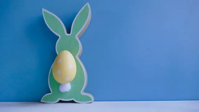 Abstract easter rabbit couple on blue background