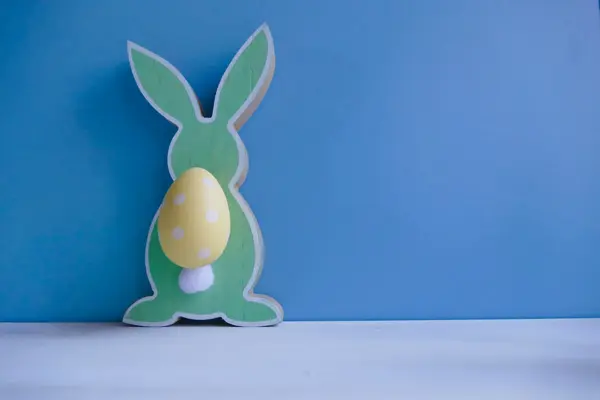 Abstract easter rabbit couple on blue background