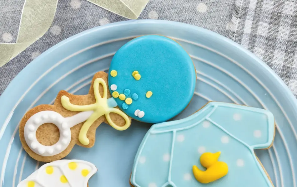 Blue and yellow cookies for a baby shower