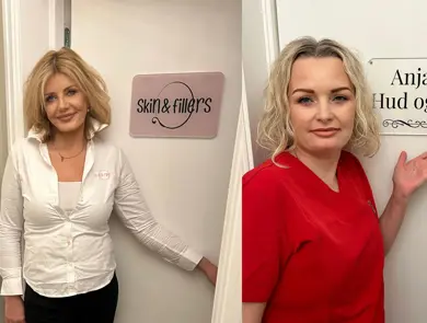 To damer som smiler til kamera