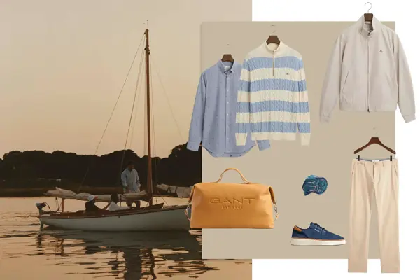 Blå skjorte, blå og hvitstripete polo-skjorte, grå jakke, weekendbag, slips, chinos og blå sneakers.