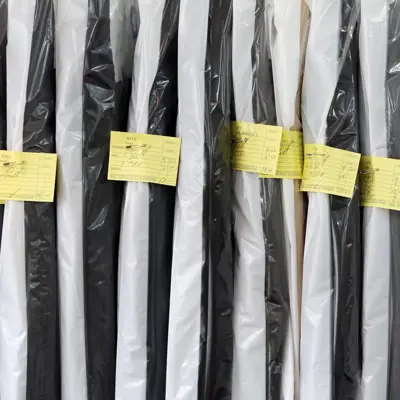 Completed dry cleaning hung neatly ready for collection.