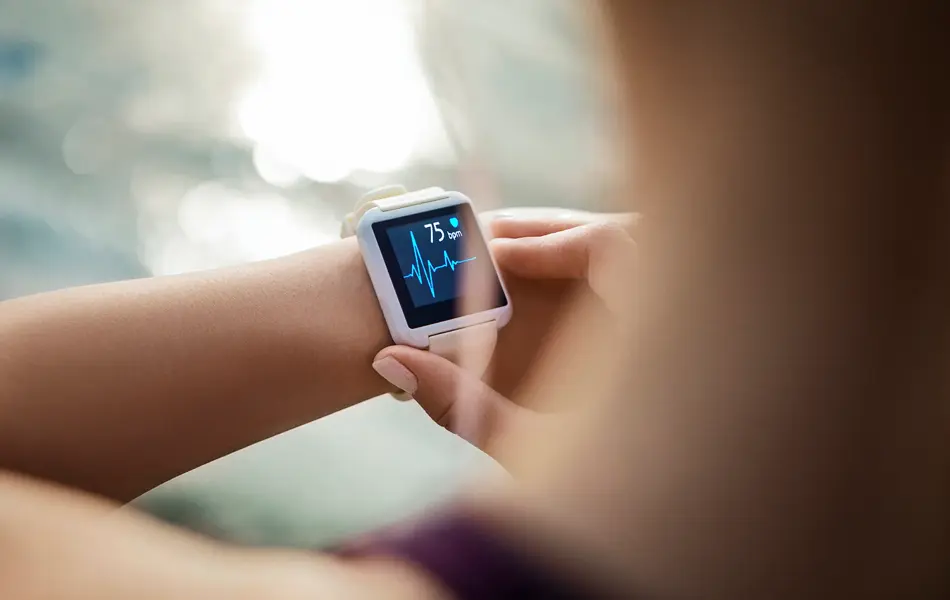 Sporty Woman Looking At Her Smart Watch
