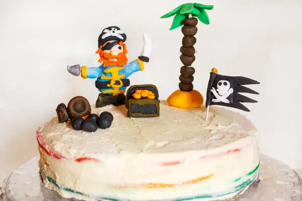 Homemade pirate rainbow cake for kid birthday.