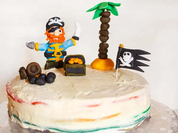 Homemade pirate rainbow cake for kid birthday.
