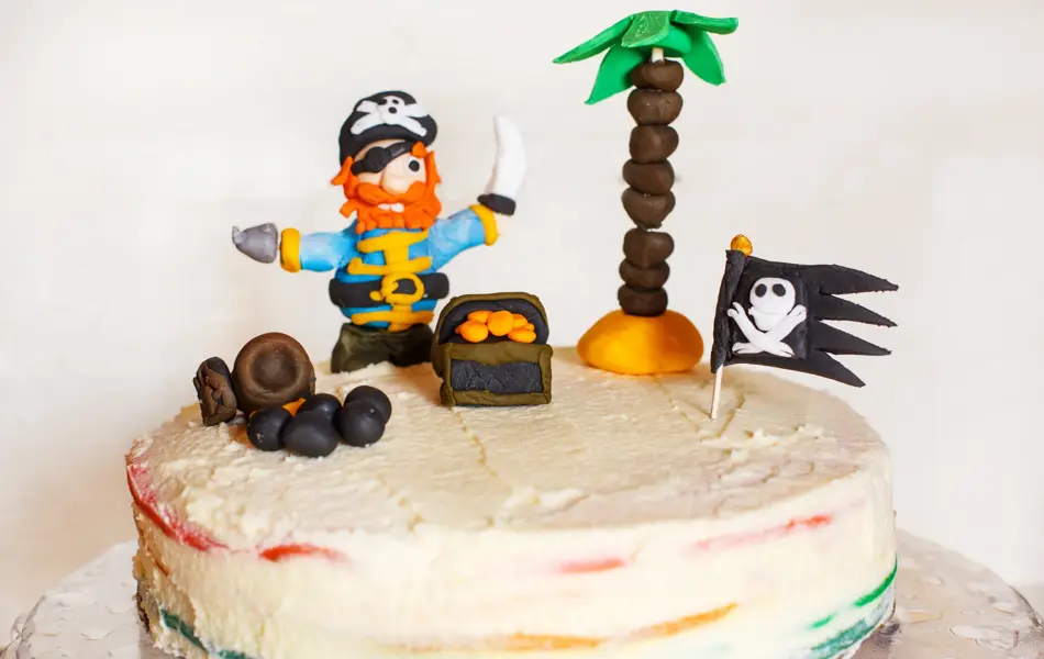 Homemade pirate rainbow cake for kid birthday.