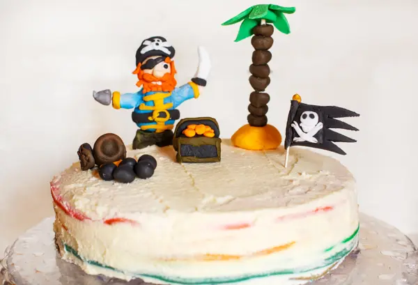 Homemade pirate rainbow cake for kid birthday.