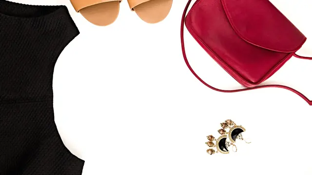 Flat lay of elegant feminine clothing and accessories.  Little black dress, nude sandals, marsala bag and earrings. Fashion blog. Copy space for text