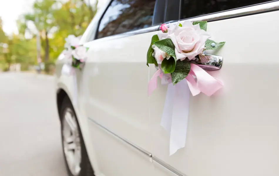 Luxury wedding car decorated with flowers