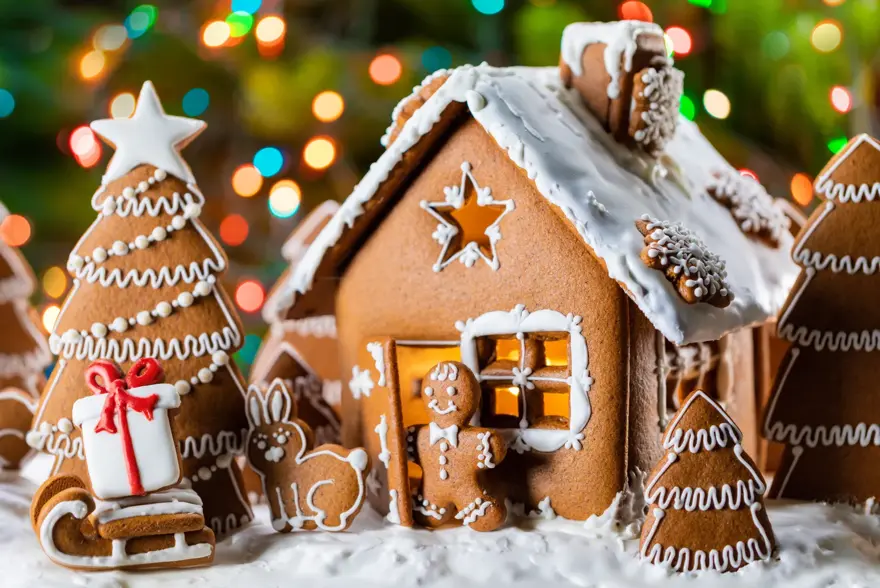 Gingerbread house christmas fir trees gift and animals cookies winter holiday celebration concept