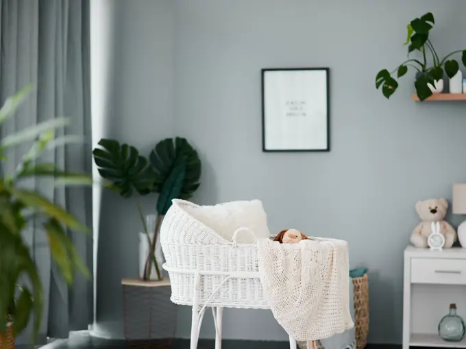 Still life shot of an empty crib in a nursery at home