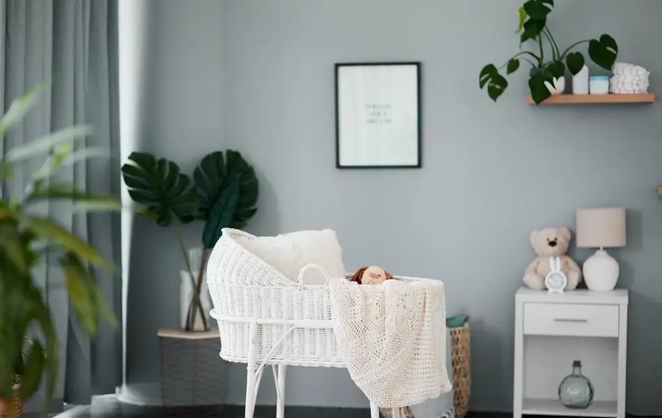 Still life shot of an empty crib in a nursery at home