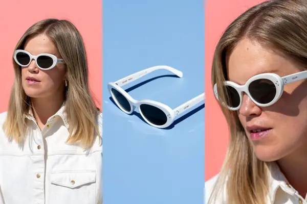 Jente med lyst hår og sorte solbriller