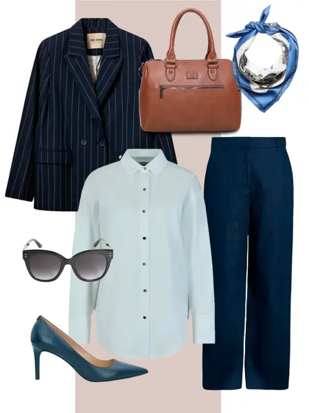 Blå med tynne hvite striper blazer, brun veske, blåmønstret halstørkle, blå penbukse, hvit skjorte, solbriller, blå pumps.