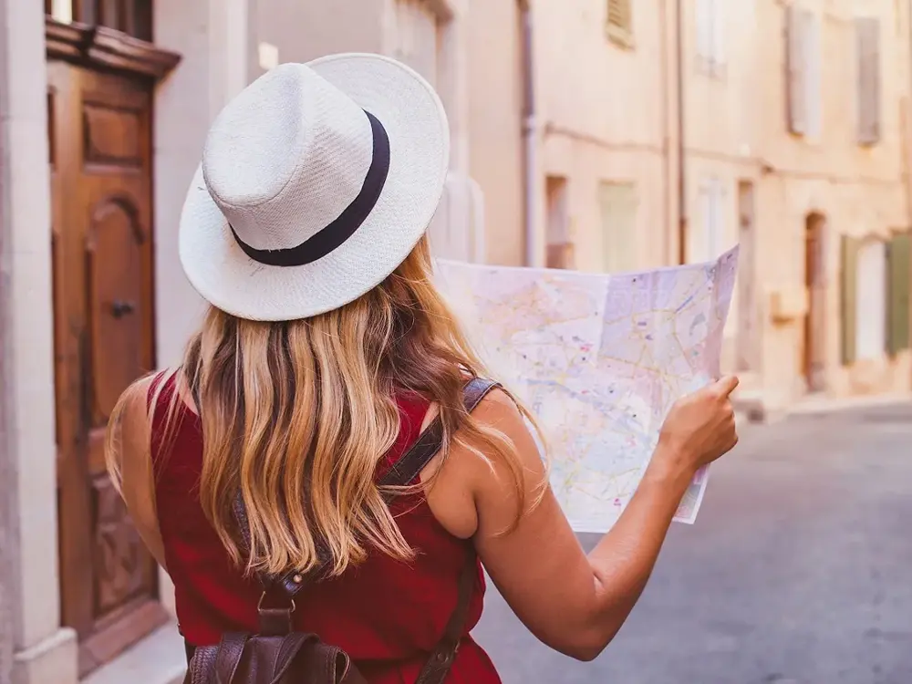 travel to Europe, tourist looking at map on the street, summer holidays sightseeing tourism