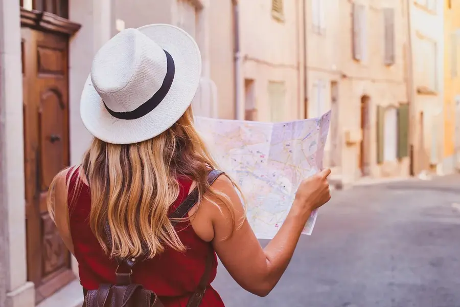 travel to Europe, tourist looking at map on the street, summer holidays sightseeing tourism