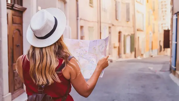travel to Europe, tourist looking at map on the street, summer holidays sightseeing tourism