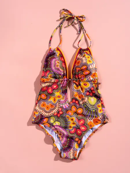 Mønstrete badedrakt - orange og rosa på rosa bakgrunn