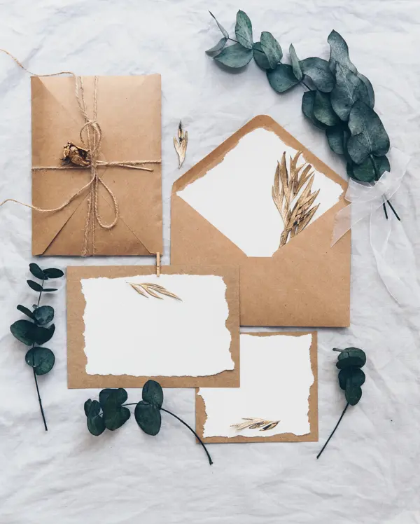 Mock up creative wedding invitation set with eucalyptus branch  on linen background