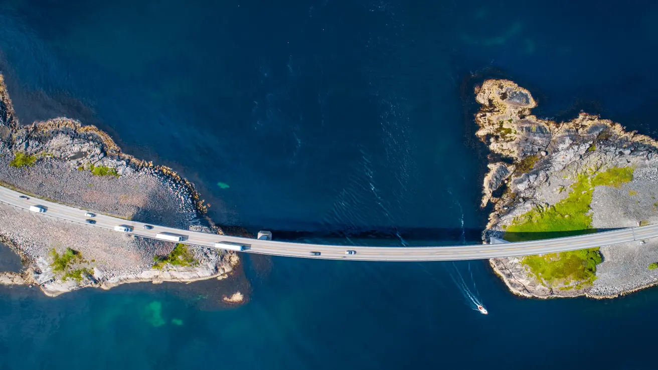 The Atlantic Ocean Road or Atlantic Road (no: Atlanterhavsveien) is a 5.2 mile (8.3km) long section of road which runs through an archipelago in Møre og Romsdal, Norway.  It's built on a series of islands and skerries which are connected by viaducts, causeways, and eight bridges.  The arched bridge pictured here is the Storseisundet Bridge, the most prominent bridge on this section of road.