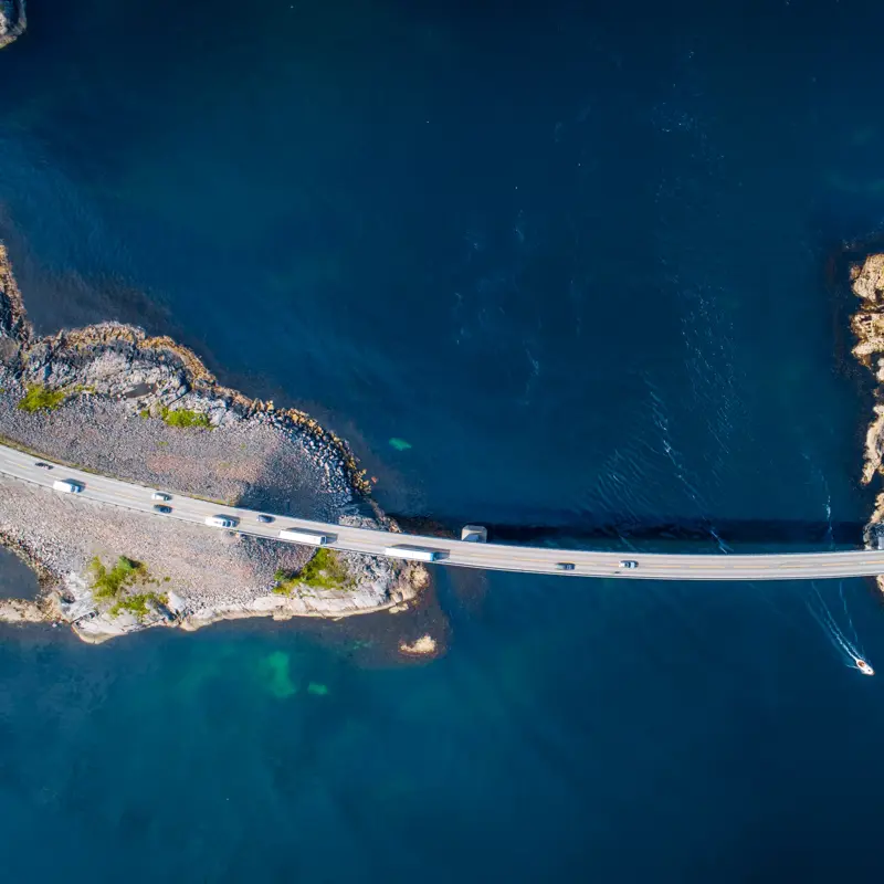 The Atlantic Ocean Road or Atlantic Road (no: Atlanterhavsveien) is a 5.2 mile (8.3km) long section of road which runs through an archipelago in Møre og Romsdal, Norway.  It's built on a series of islands and skerries which are connected by viaducts, causeways, and eight bridges.  The arched bridge pictured here is the Storseisundet Bridge, the most prominent bridge on this section of road.
