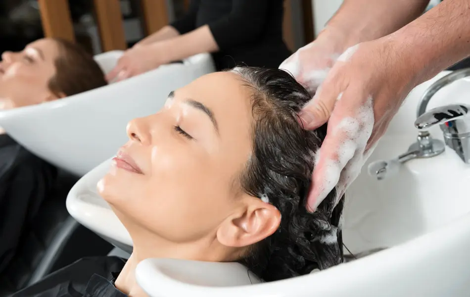Woman is having a hair wash.