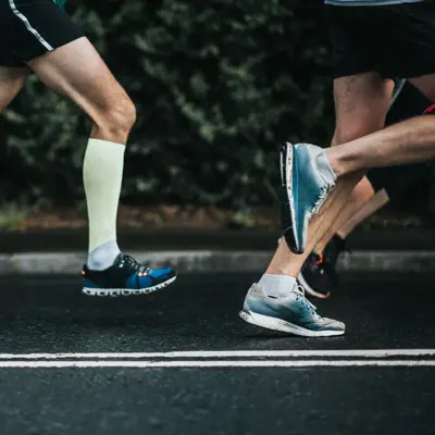 Joggers running on tarmac.