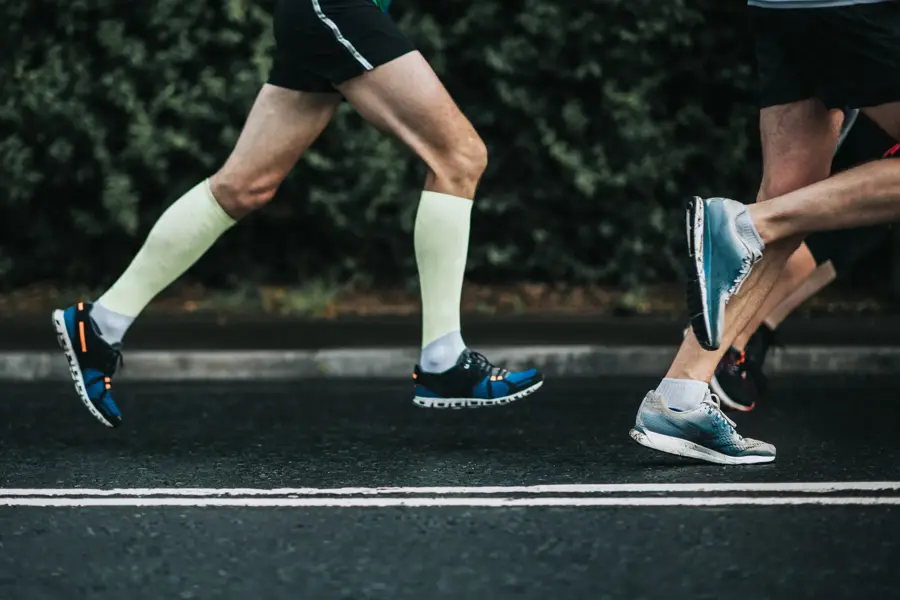 Joggers running on tarmac.