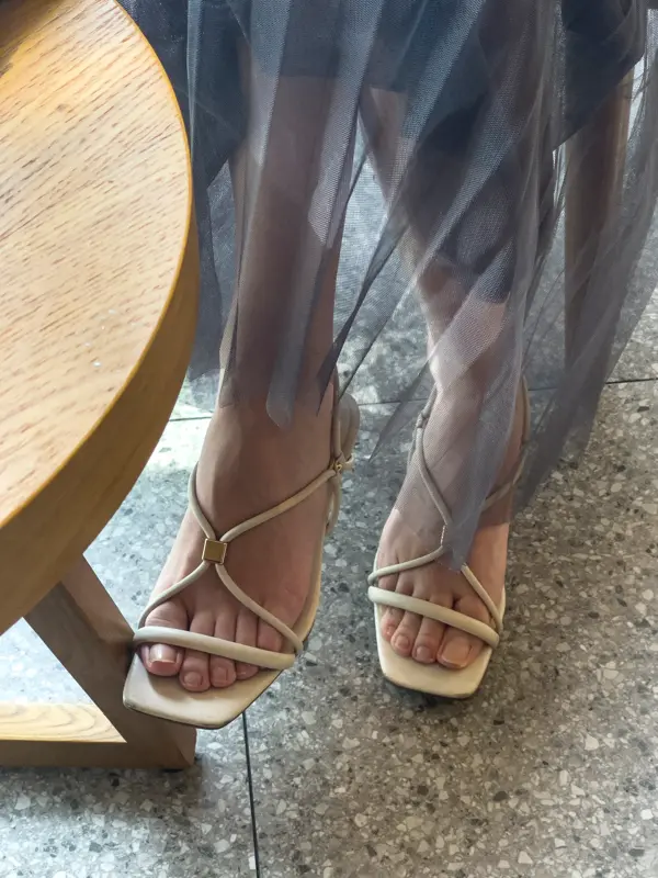 Woman crossed her legs gracefully at the coffee table