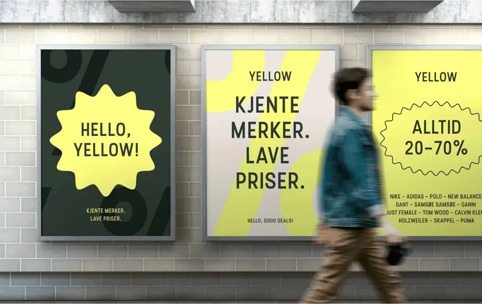 mann som går forbi reklameskilter