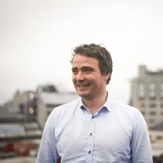 Portrettbilde av Jarle Andersen Aasness. Han smiler. 