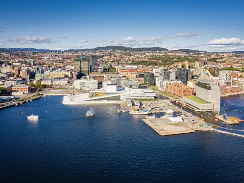 Oslo Cityscape Aerial View of Harbor Waterfront with Opera House, Office Buildings and Promenade on a sunny day. Drone point of view to the cityscape horizon. Oslo, Norway, Scandinavia