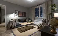Bilde av stue med sofa og lenestol fra Skitorget på Skeikampen