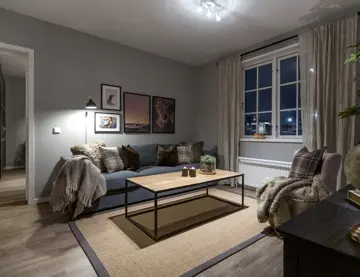 Bilde av stue med sofa og lenestol fra Skitorget på Skeikampen