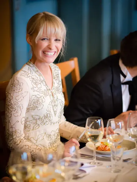 The bride smiles a genuinely happy grin for the camera.