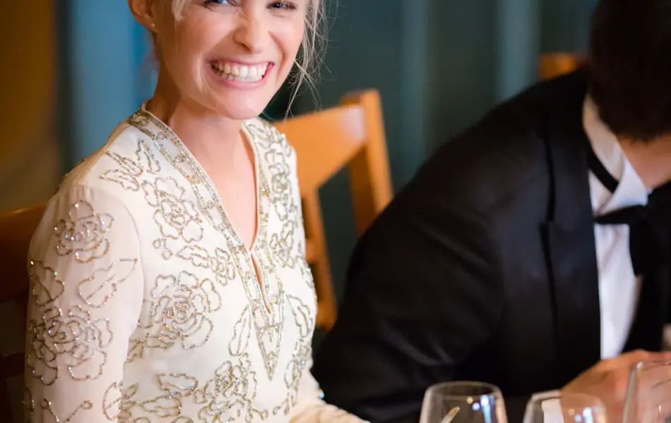 The bride smiles a genuinely happy grin for the camera.