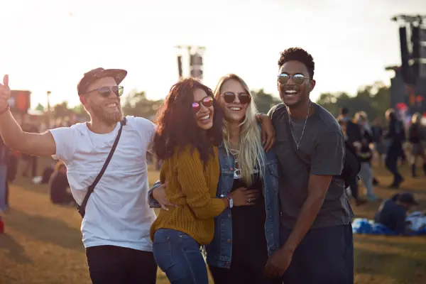 Friends hanging out at big music festival