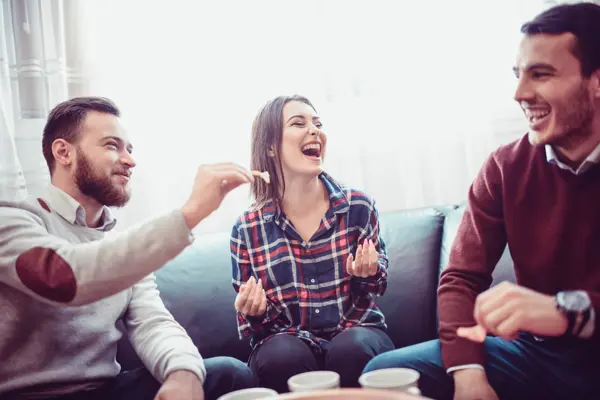 Group of Friend Eating Snacks, Conversing and Having Fun Time Together