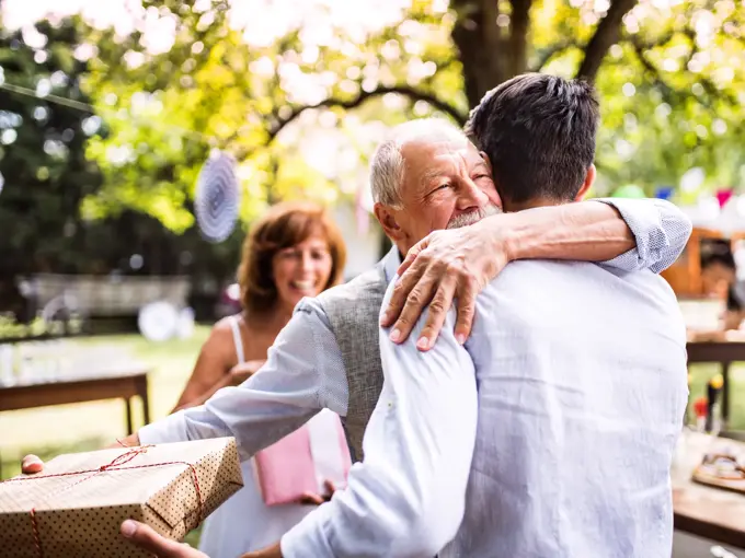 Family celebration outside in the backyard. Big garden party. Birthday celebration.