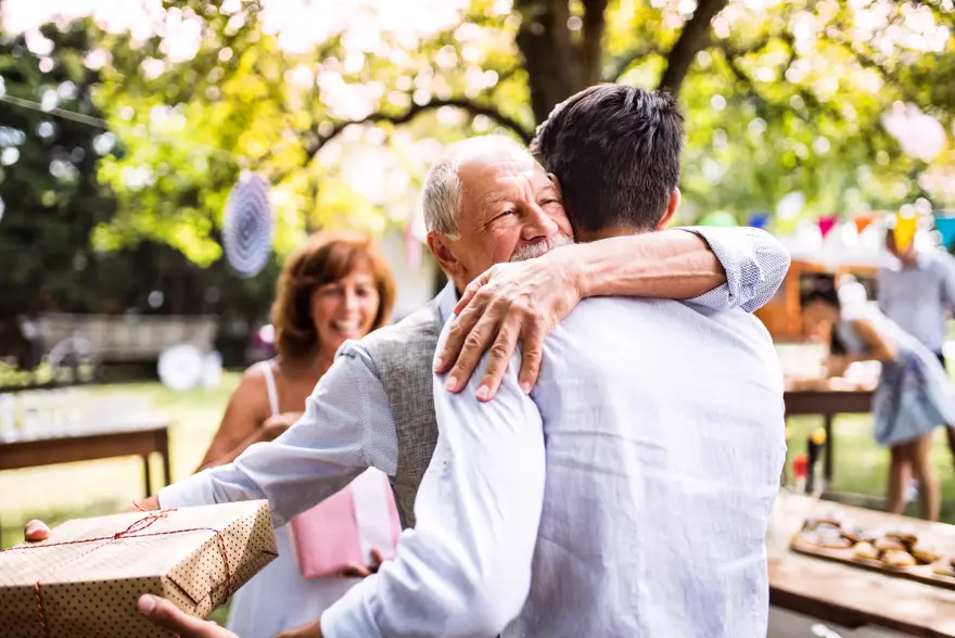 Family celebration outside in the backyard. Big garden party. Birthday celebration.
