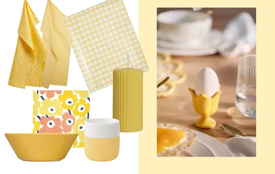 To gule kjøkkenhånklær, rutete duk, blomstrete servietter, gult kubbelys, gul bolle, gul og hvit kaffekopp.