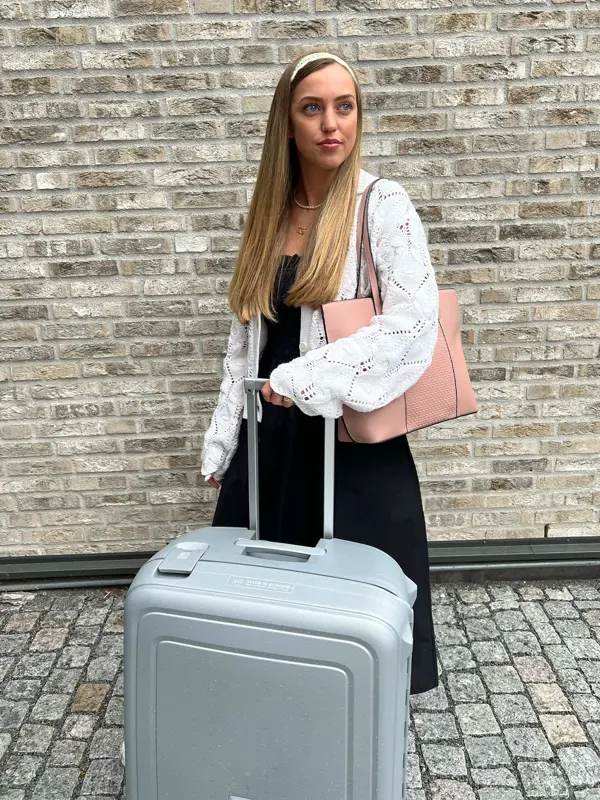 Dame med koffert