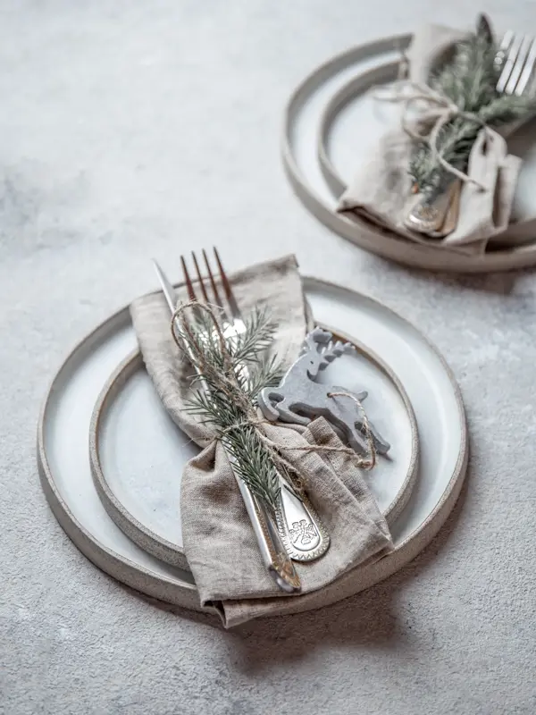 Cristmas table cutlery set with holiday decoration. Top view, copy space.