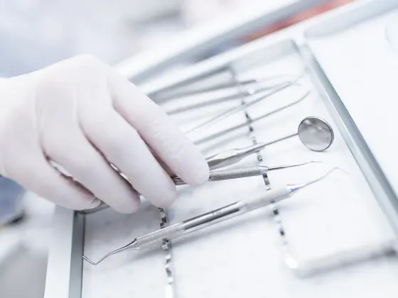 MODEL RELEASED. Close-up of dental equipment in dentists hand.