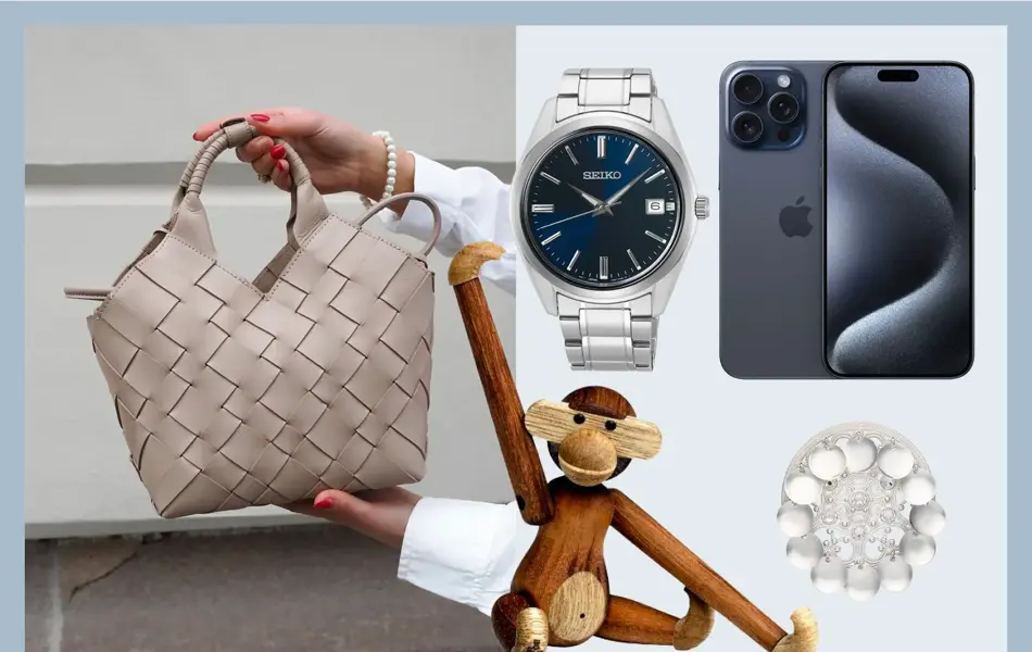 Hender holder en skinnveske, klokke, iPhone, Kai Bojesen ape, bunadsølje