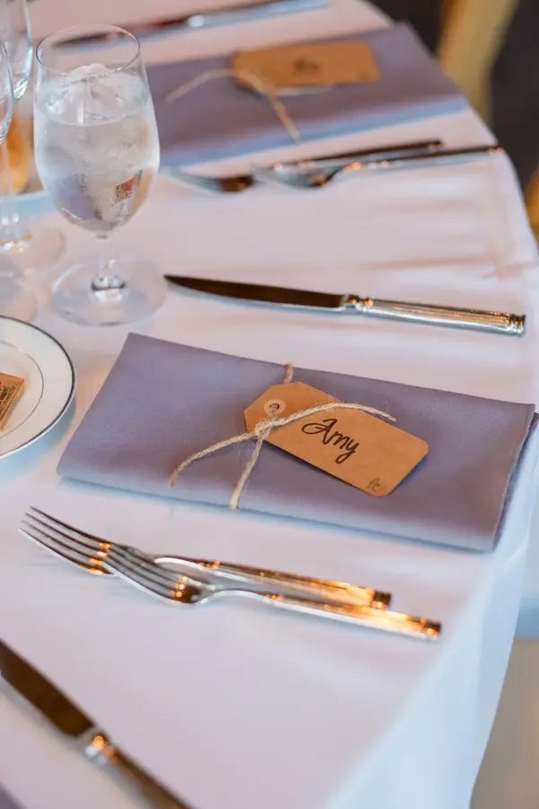 Wedding reception seating with folded napkin name tags to create a seating assignment for this beautiful event.