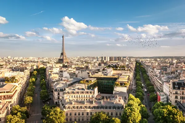 View of Eiffel Tower between trees, Paris, France.
Image taken outdoors, daylight, no people in the image.